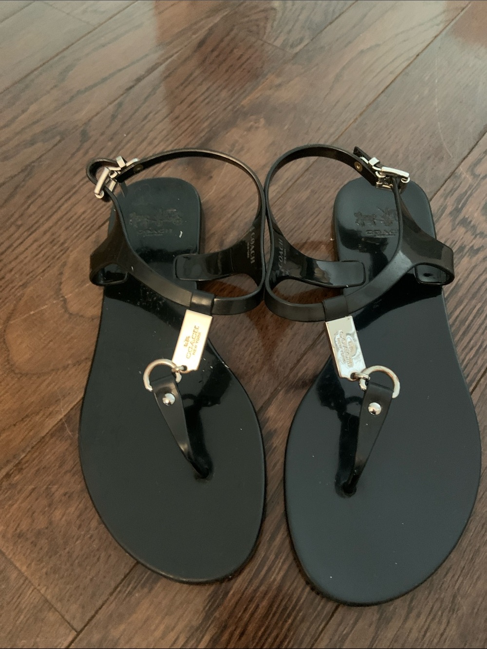 Coach Black Patent Jelly T-Strap Sandals with Gold Plaque